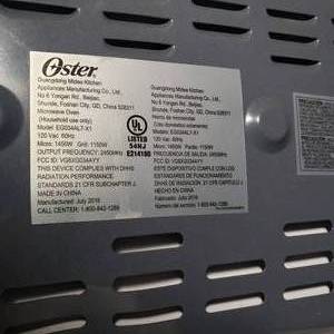 lot 108 image: Oster Microwave