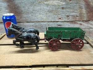 lot 15 image: Antique Arcade Toy Cast Iron Horse and McCormick Deering Wagon