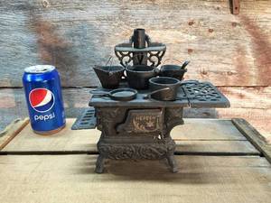 lot 16 image: Cast Iron Crescent Miniature WoodCook Stove with Utensils