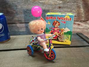 lot 17 image: Vintage Wind-up Tin Toy Girls Tricycle With Box