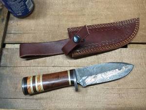 lot 129 image: Custom Hunting Knife - Damascus Steel blade, layered wood and inlay handle, leather sheath - newish