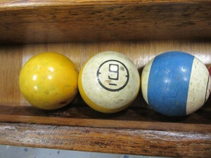 Brunswick Ivory Pool Balls & Wall Rack
