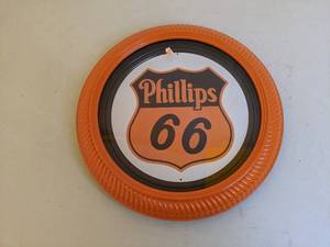 lot 129 image: Phillips 66 Orange Plastic Round Wall Hanging