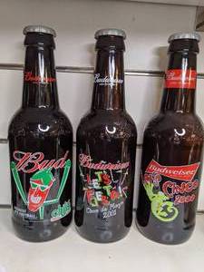 lot 1553 image: Lot of Three Collectible Budweiser Bottles (250)