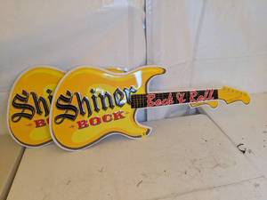 lot 167 image: Pair of Shiner Bock Metal Bock & Roll Guitar Advertising Signs
