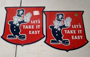 lot 460 image: Pair of Ford Motors Lets Take It Easy Policeman Signs