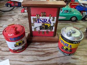 lot 613 image: MSRA racing Toy Gas can replicas and MSRA clock