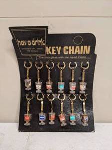 lot 369 image: 12 Hav a Drink Mini Cocktail Glass Advertising Key Chains on Board