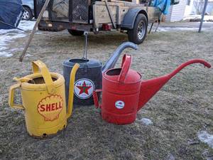 lot 810 image: Three Metal Vintage Watering Cans- Shell, Mobile, Texaco