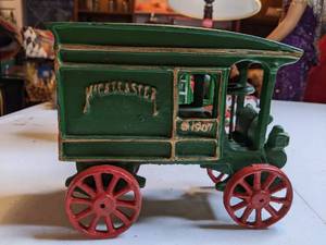 lot 1313 image: (2) Vintage Cast Iron Horse Drawn Wagon McCallisters General Mercantile OHIO adver