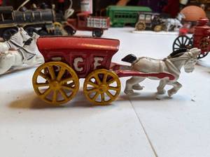 lot 1316 image: Vintage Price Cast Iron Horse Drawn Ice Carriage with Rider and Cast Iron Fireman Toy