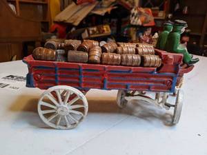 lot 1323 image: Vintage Cast Iron Horse Pulling a Beer Wagon Loaded with Wood Barrels, 8 Horses, 2 Men, 1 Dog and Wagon with 29 Wood Barrels