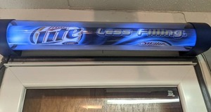 lot 1100 image: Miller Lighted Rotating Lighted Beer Sign
