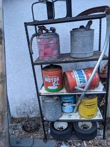 lot 880 image: Metal Shelving Unit Filled with Gas Cans