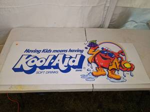 lot 184 image: Large Embossed Kool-Aid Advertisement