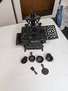 lot 974 image: Miniture Crescent Cast Iron Stove