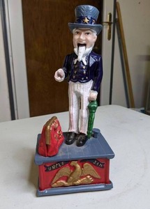 lot 975 image: Uncle Sam Vintage Mechanical Cast Iron Coin Drop Piggy Bank