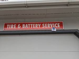 lot 1406 image: Vintage Tire and Battery Service Sign
