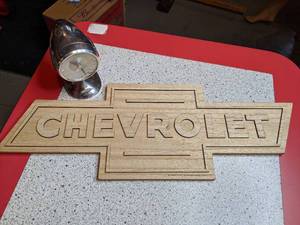 lot 1349 image: Wood Chevrolet Sign & Tachometer Clock