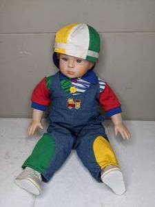 lot 1394 image: Boy doll with multi colored outfit and Spoiled Rotten hat