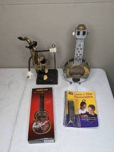 lot 1395 image: Music themed art decor and Harmonica