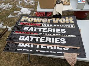 lot 1127 image: Metal Signs PowerVolt Batteries