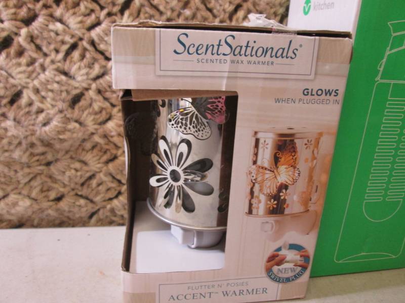 lot 212 image: Wax Warmer, Water Bottle, Wrist Bra...