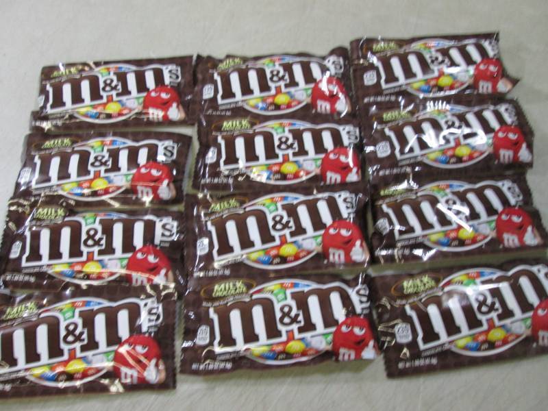 lot 222 image: 12 Bags of M&Ms Best by Aug 2020  ...