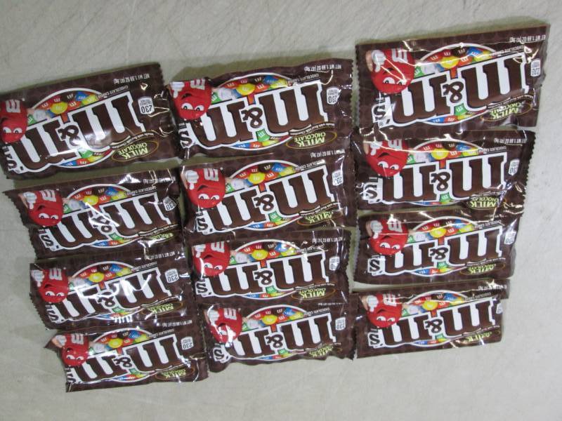 lot 224 image: 12 Bags of M&Ms Best by Aug 2020  ...