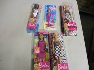 4 Barbie Dolls and a Mermaid Doll...