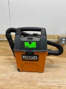 lot 73 image: RIDGID 3 Gal. 3.5-Peak HP Portable WetDry Shop Vacuum with Built-in Dust Pan, Filter, Expandable Hose and Car Nozzle