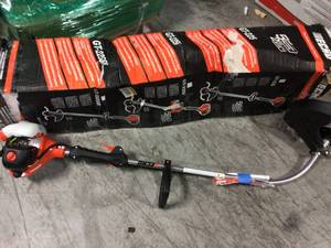 lot 17 image: 21.2 cc Gas 2-Stroke Cycle Curved Shaft Trimmer by ECHO in working condition see pics customer return. 