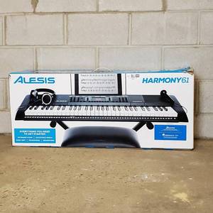 lot 066 image: Alesis Melody 61 MKII  61 Key Portable Keyboard with Built In Speakers, Headphones, Microphone, Piano Stand, Music Rest and Stool