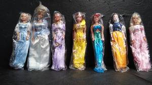 7 NEW IN PLASTIC PRINCESS BARBIES