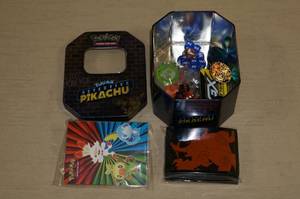 lot 47 image: Metal Tin of Pokemon Game Accessories