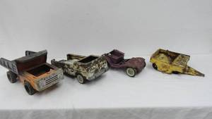 lot 74 image: Vintage Metal TrucksDump BuggyPacker