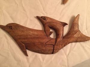 lot 36 image: Four Wooden Dolphins