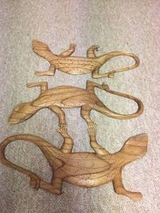 lot 86 image: Three Large Wooden Carved Lizards
