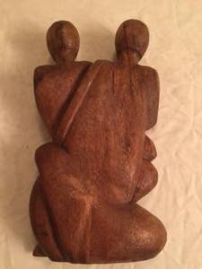 lot 74 image: Parents and Baby Carving