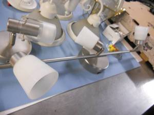 Many light fixtures including single sconce, light bar, hanging lights and supplies