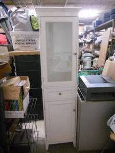 Tall white cabinet, glass door, shelves, drawer, solid door