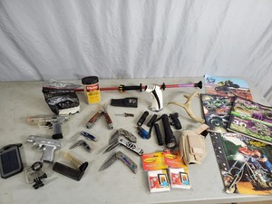 lot 91 image: Pocket Knives, Flashlights, Blow Gun, GoPro Case, and More