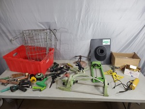 lot 141 image: Tote with Lawn Sprinklers, Bicycle Basket, and More