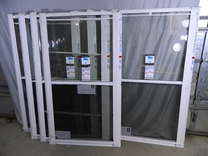 lot 42 image: 5 New Larson Storm Windows 36 x 63 inches.
