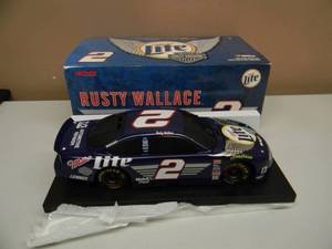 lot 33 image: Rusty Wallace #2 Miller Lite  Harley Davidson 1999 Taurus 124 Scale Diecast - LIMITED EDITION 1 OF 5004 - NEW IN BOX - SEE PICTURES
