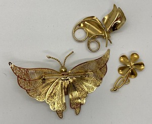lot 78 image: Three Assorted Golden Baubles