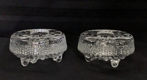 lot 123 image: A Pair of Iittala Ultima Thule Pattern Glass Candle Holders