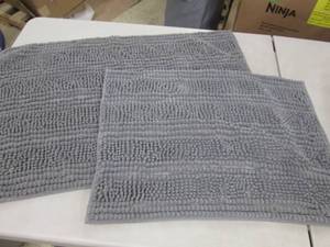 2 Grey Bath Rugs...