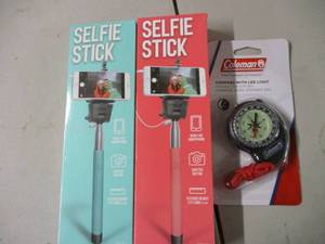 lot 18 image: 2 Selfie Sticks and A Coleman Compa...