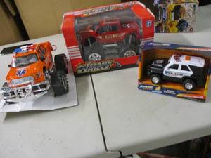 lot 23 image: 3 Toy Rescue Trucks...